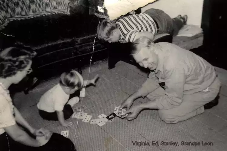 Leon playing cards with children