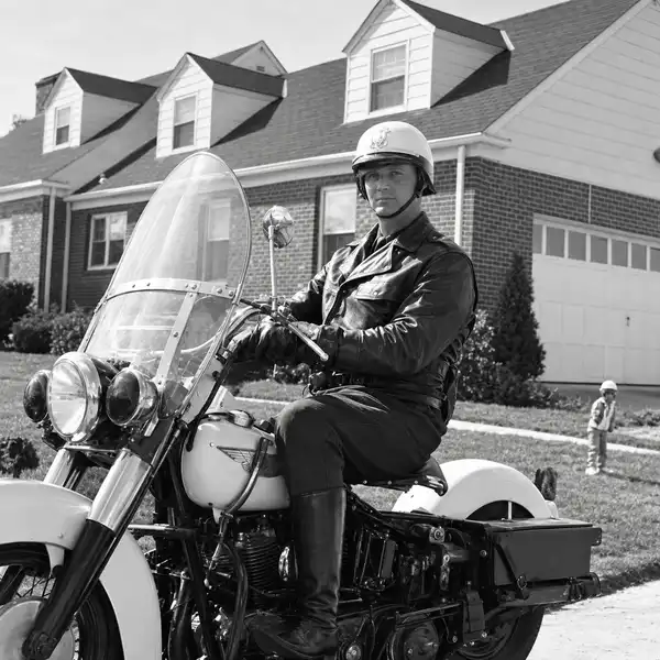 Puts on police motorcycle